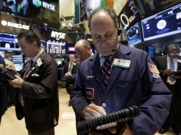 El índice compuesto del mercado Nasdaq retrocede 11.87 unidades. AP /