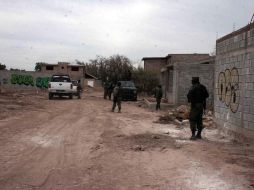Militares, policías federales y agentes de la PGR participan en las labroes. ARCHIVO /