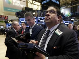 Los indicadores estadounidenses tuvieron ganancias, siendo el Nasdaq el que marcó una cifra histórica. AP /