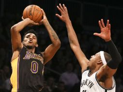 Youn salta para anotar contra Nets. AP /