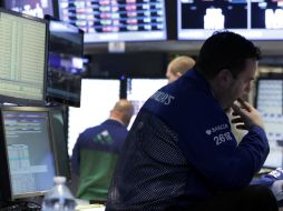 Los inversores evalúan que la Reserva Federal suspenda su programa de estímulo económico. ARCHIVO /