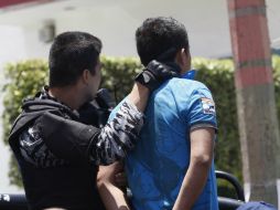 Los ahora detenidos comenzaron a contradecirse mientras eran interrogados por los policías. ARCHIVO /