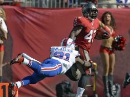 Bobby Rainey (43) anotó en un acarreo de 80 yardas. AP /