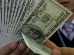 En 12.9730 pesos el tipo de cambio para solventar obligaciones denominadas en moneda extranjera. ARCHIVO /