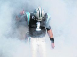 Cam Newton buscará un logro más en su carrera al arrebatarle a Brees y sus Santos el primer lugar de la División Sur. AP /