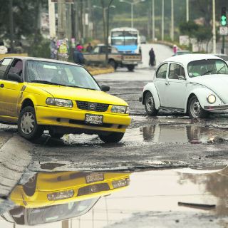 Baches, la consecuencia de las lluvias invernales en la ciudad