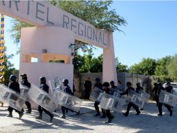 En el enfrentamiento fueron abatidos cuatro reclusos y cinco de los agresores. AFP /