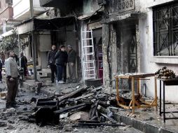Las calles devastadas. Las consecuencias de un ataque con granadas propulsadas por cohete en la ciudad de Homs. EFE /