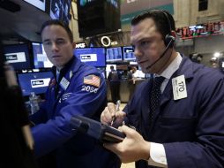 El índice de referencia de Wall Street restó 7.71 enteros. AP /