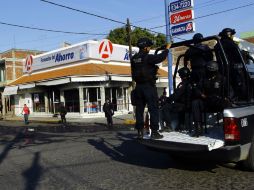 El incendio en una farmacia del municipio michoacano no tuvo ninguna persona herida, pero si el reforzamiento de la vigilancia. AFP /