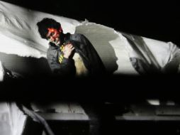 Fotografía de la policía de Massachusetts que muestra el momento de la captura de Dzhokhar Tsarnaev, el 19 de abril de 2013. AP /
