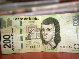 La moneda mexicana resiste sin incrementos significativos la turbulencia generada por la política monetaria de la Fed. ARCHIVO /