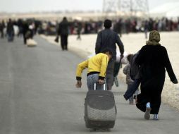 Las personas fueron llevadas a los lugares de su elección escoltadas por  personal de la ONU y de la Media Luna Roja. ARCHIVO /