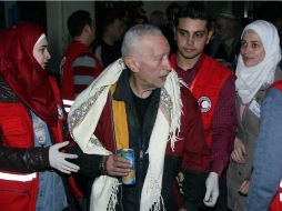 Niños, mujeres y hombres de avanzada edad, fueron evacuados del antiguo casco de Homs. AFP /