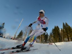A pesar de ello, tratan de que los atletas no se sientan distraídos durante la 'vigilancia'. AFP /