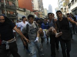 El miércoles se registraron disturbios en Venezuela, que según Maduro fueron planeados por EU. ARCHIVO /