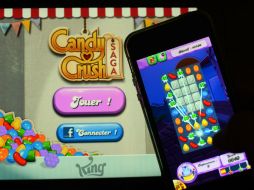King ofrece más de 180 juegos en 14 lenguajes a través de teléfonos móviles, Facebook y su propio sitio web. AFP /