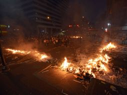 Miles de estudiantes protestan contra el gobierno de Nicolás Maduro en rechazo a la inseguridad, la inflación, y el desabastecimiento. AFP /