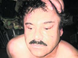Joaquín el 'Chapo' Guzmán, al momento de ser capturado en el hotel Miramar de Mazatlán. La imagen fue tomada por uno de los agentes. NTX /