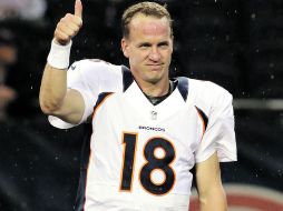 Visto bueno. Manning rompió la marca de más pases de anotación y yardas por aire en la temporada pasada. AP /