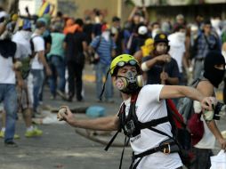 El ministro del Exterior de Venezuela dice que la fuerza oficial ha sido usada ''de forma proporcional y diferenciada''. AFP /