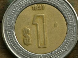 La paridad peso dólar se ubica 13.2312 unidades, con una variación de 0.12 por ciento. ARCHIVO /