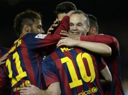 El club culé se puso líder provisional de la liga española. AFP /