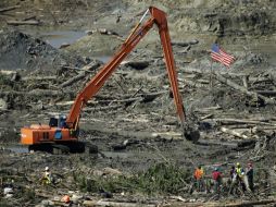 Rescatistas continúan trabajando en la zona para la búsqueda de cuerpos. ARCHIVO /