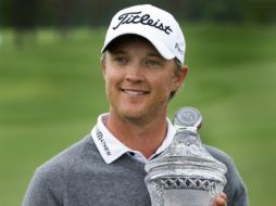 Jones logra con este triunfo su primer título en el circuito de la PGA. AP /