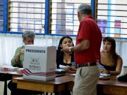 Las votaciones se desarrollan para elegir al nuevo presidente y a dos vicepresidentes de la República. AFP /
