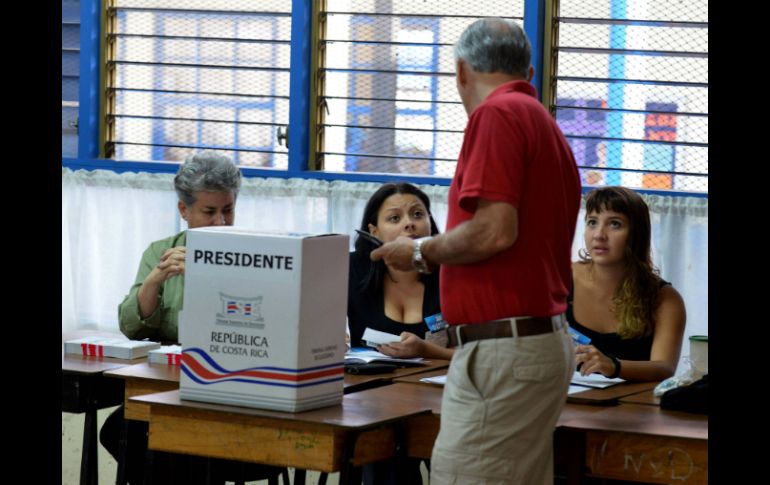 Las votaciones se desarrollan para elegir al nuevo presidente y a dos vicepresidentes de la República. AFP /