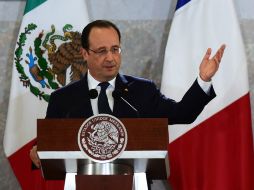 México, señala Hollande, ha emprendido numerosa reformas constitucionales que le ayudarán a modernizarse en el futuro cercano. AFP /