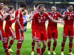 El equipo celebran su triunfo tras vencer 2-0 a los Leones y van por la semifinal de la Champions ante Real Madrid. AFP /