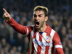 El cuadro Rojiblanco es líder de la liga española y podría ganar la Liga de Campeones. EFE /