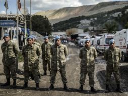 Por otra parte, fuerzas de seguridad son reforzadas para controlar las entradas a la ciudad minera de Soma. AFP /