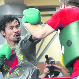 Pacquiao se queda con Bob Arum