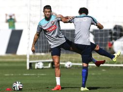 Cristiano entrenó con su compañeros, pero no participó en el trabajo con el balón. EFE /