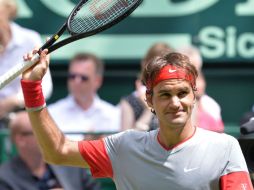 Federer no tuvo que jugar para meterse a las semifinales, pues su rival, Yen-Hsun Lu, declinó por molestias físicas. AP /