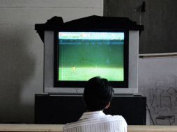 Durante Sudáfrica 2010 y Alemania 2006 se registraron espectadores chinos con trastornos físicos o incluso muertos de agotamiento. ARCHIVO /