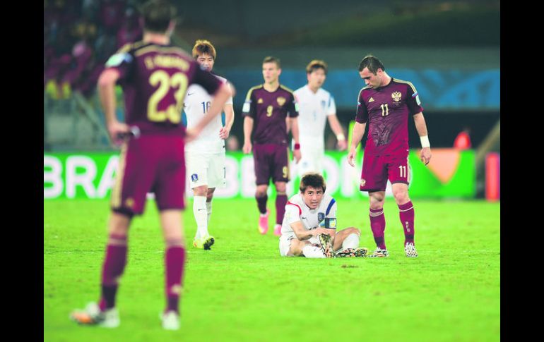 Tablas. Coreanos y rusos sacaron un punto de su debut mundialista. AFP /