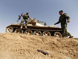 Soldados iraquíes continúan vigilando, antes los posibles ataques de los insurgentes suníes. AFP /