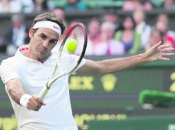 El suizo Roger Federer, campeón siete veces en Wimbledon, abandonó la edición anterior tras caer eliminado en la segunda ronda. AP /
