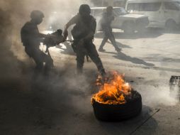 Los choques en las calles pusieron fin a una semana de actos violentos que incluyeron explosiones pequeñas. AFP /