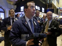 El NYSE Composite avanza 23.73 puntos mientras que el Nasdaq Composite asciende 4.50 puntos. AP /