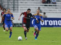 Acción de juego del encuentro entre Atlas y Tigres.  /