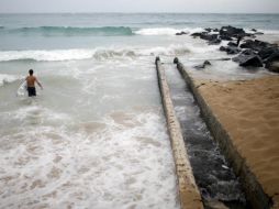 La NOAA ha pronosticado para esta temporada la formación de entre ocho y 13 tormentas tropicales. AP /