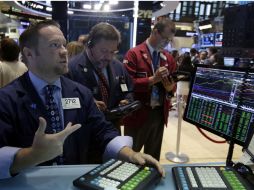 El índice NYSE Composite abre a la baja con 10 mil 577.08 unidades. AP /