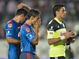 Fernando Arce y José Antonio Rodríguez se lamentan luego de la primera anotación en su contra. MEXSPORT /