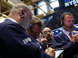El NYSE Composite que sube 33.74 puntos, 0.32 por ciento. AP /