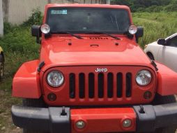 Los detenidos viajaban a bordo de un Jeep Sahara naranja. ESPECIAL /